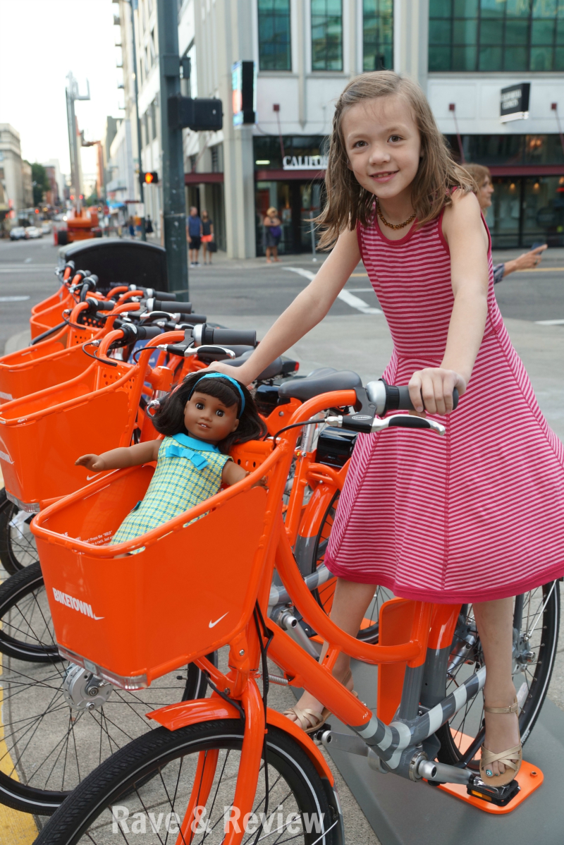 American Girl Melody on bike